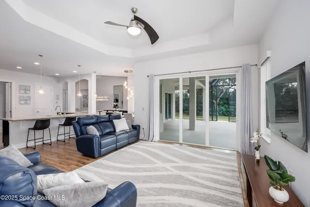 a bedroom with a bed lamp and a potted plant