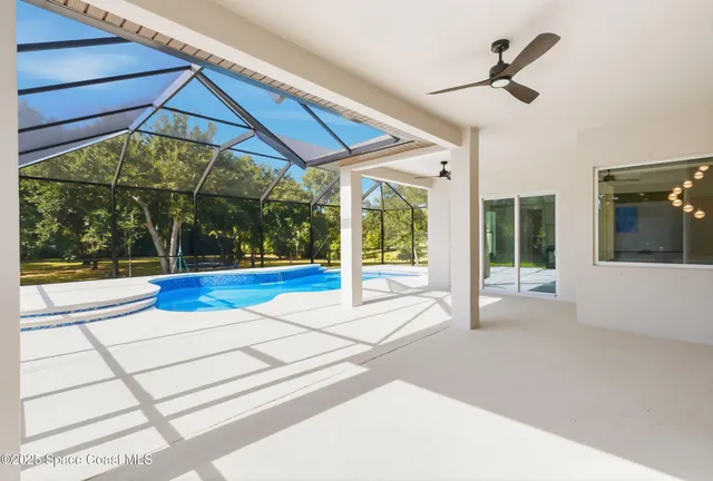 a view of a swimming pool with a lounge chairs