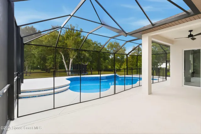 a backyard of a house with lots of green space