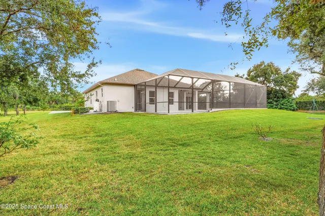 a view of a park with large trees