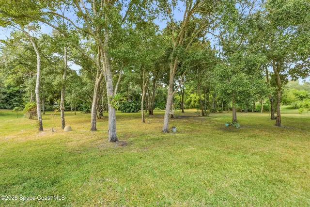 a view of a swimming pool with an outdoor space and seating area