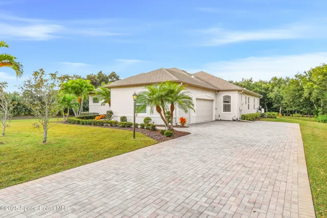 a view of house with swimming pool outdoor seating