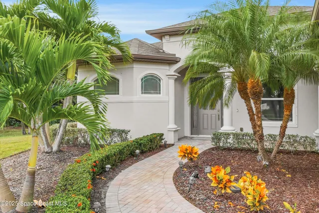 a view of a house with a small yard
