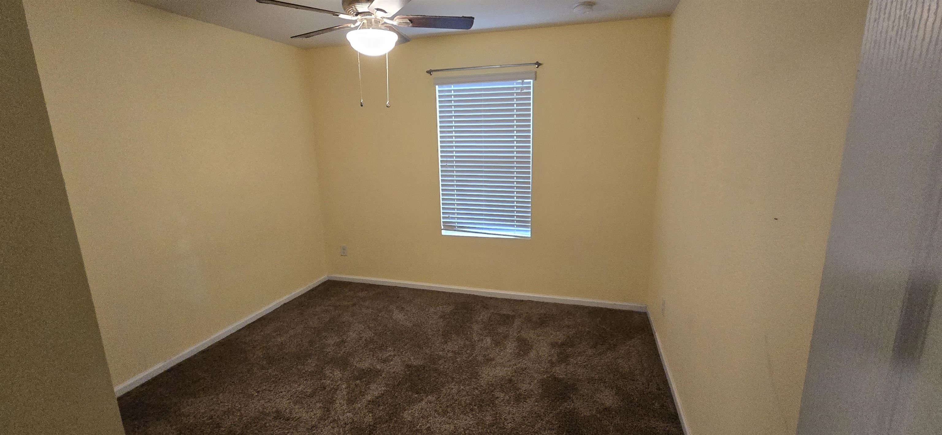 194 Ashby Lndg Way St. Augustine, FL 32086 - Photo 12 of 12 an empty room with a window and a ceiling fan