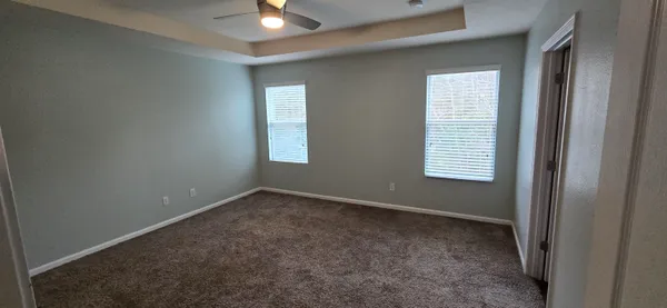 an empty room that has a window in it