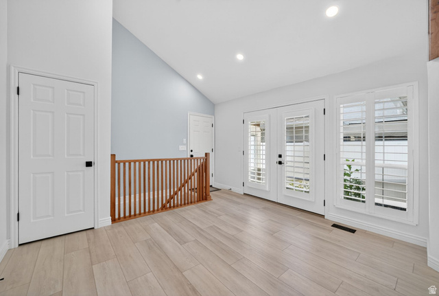 6969 South 855 East Midvale, UT 84047 - Photo 23 of 55 Interior space featuring light wood-finish flooring, white walls, and a vaulted ceiling with recessed lighting