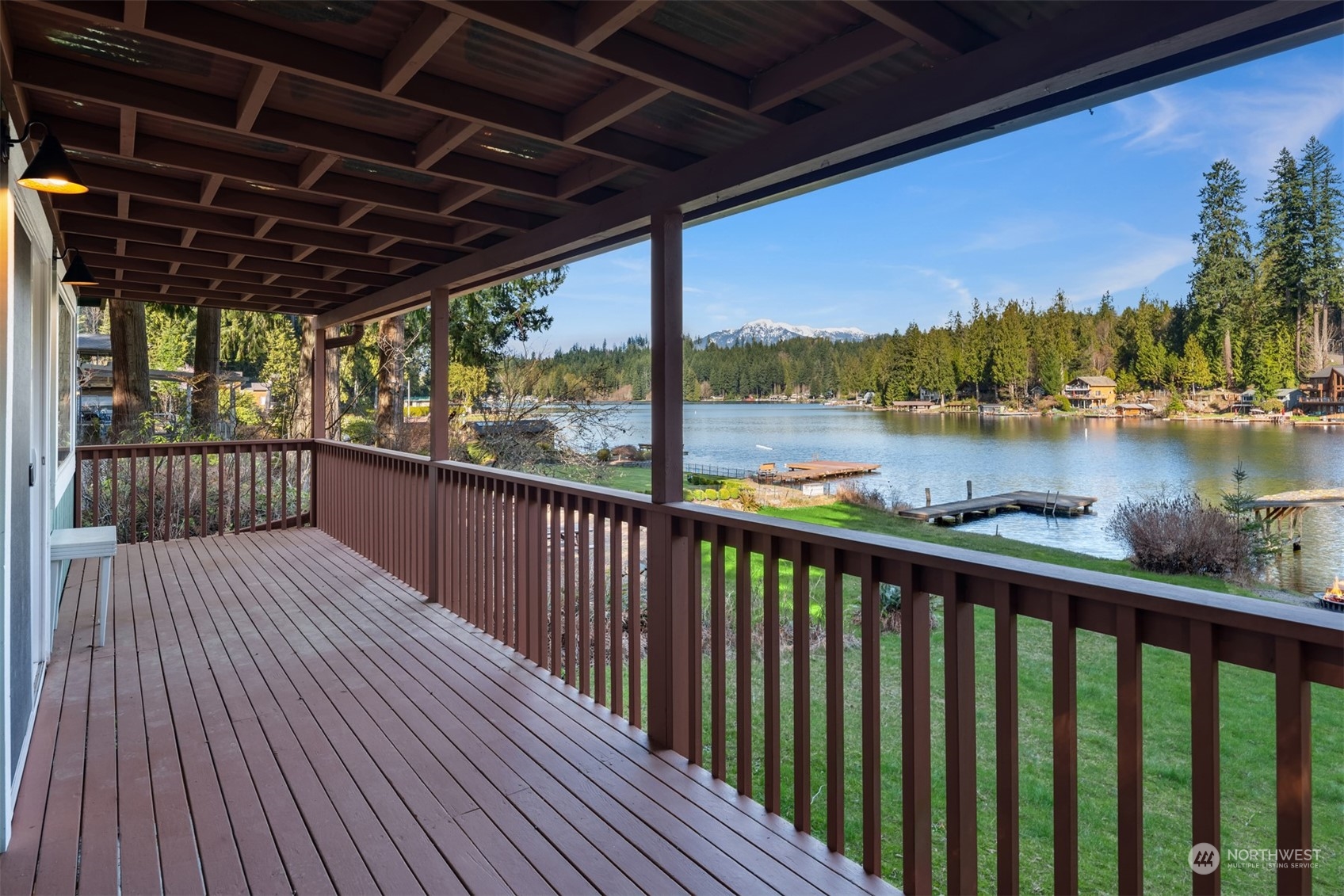 2631 Southwest Lake Roesiger Road Snohomish, WA 98290 - Photo 12 of 18 a view of a balcony with wooden floor and outdoor space
