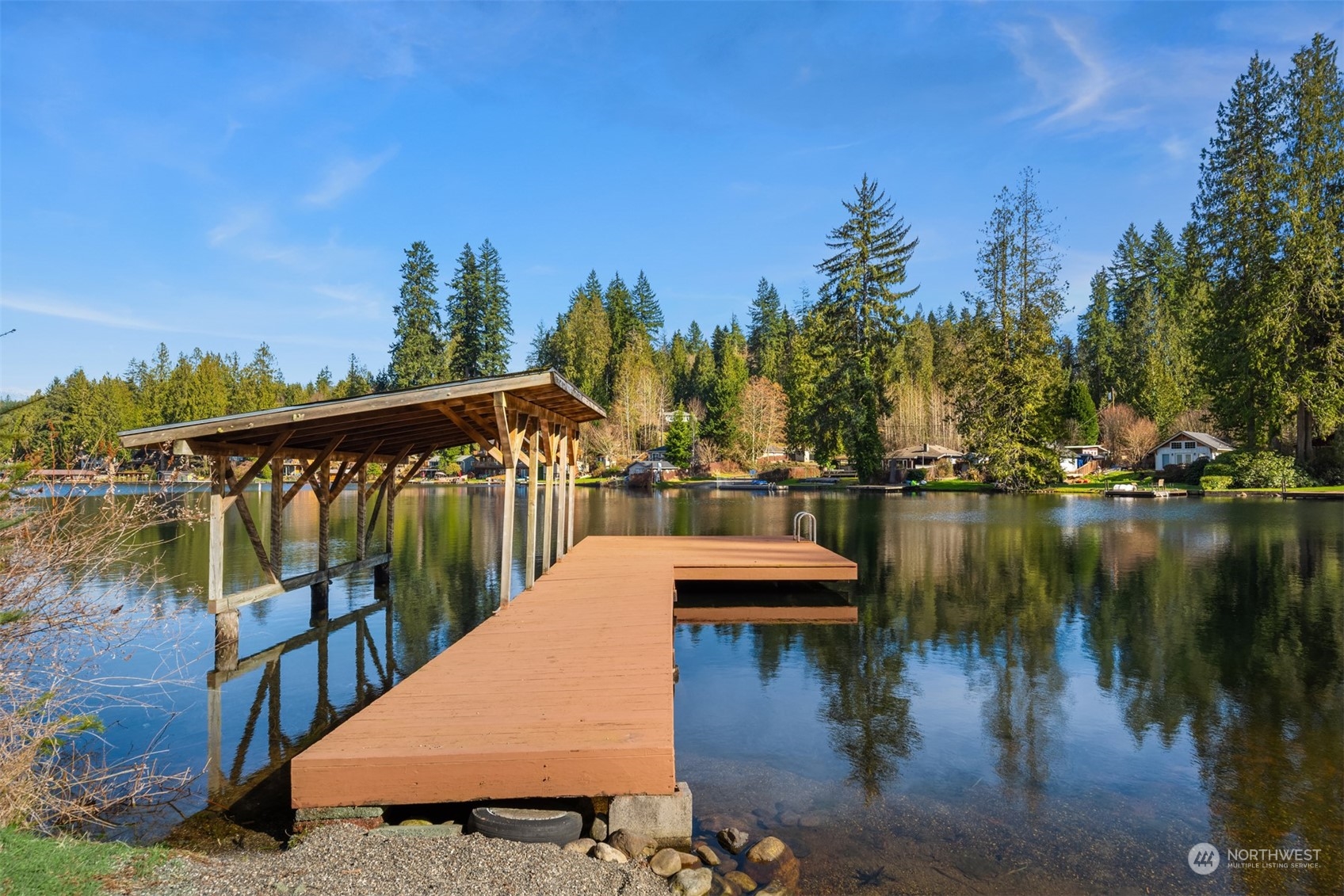 2631 Southwest Lake Roesiger Road Snohomish, WA 98290 - Photo 13 of 18 a balcony with wooden floor and lake view