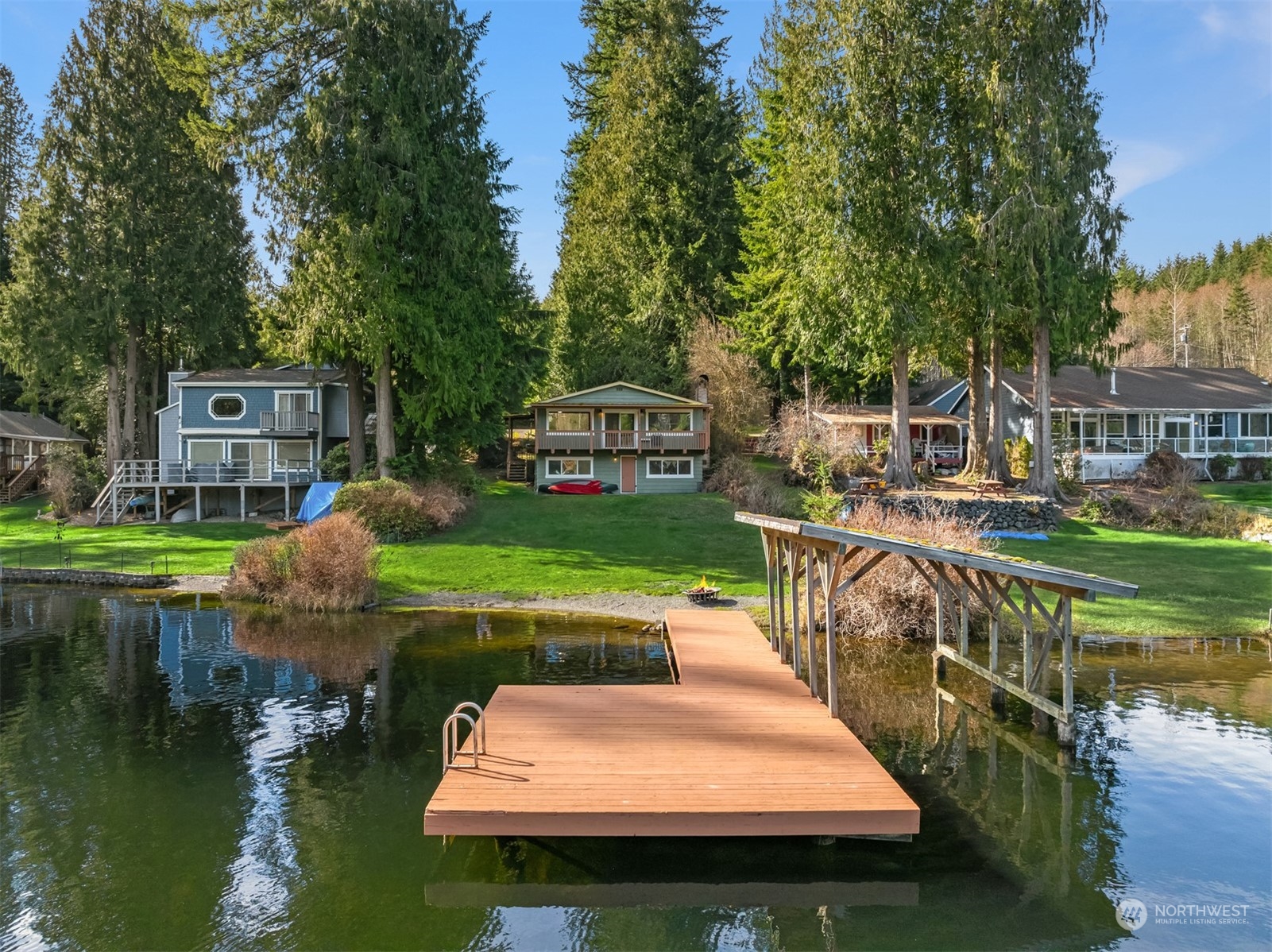 2631 Southwest Lake Roesiger Road Snohomish, WA 98290 - Photo 15 of 18 a swimming pool with chairs