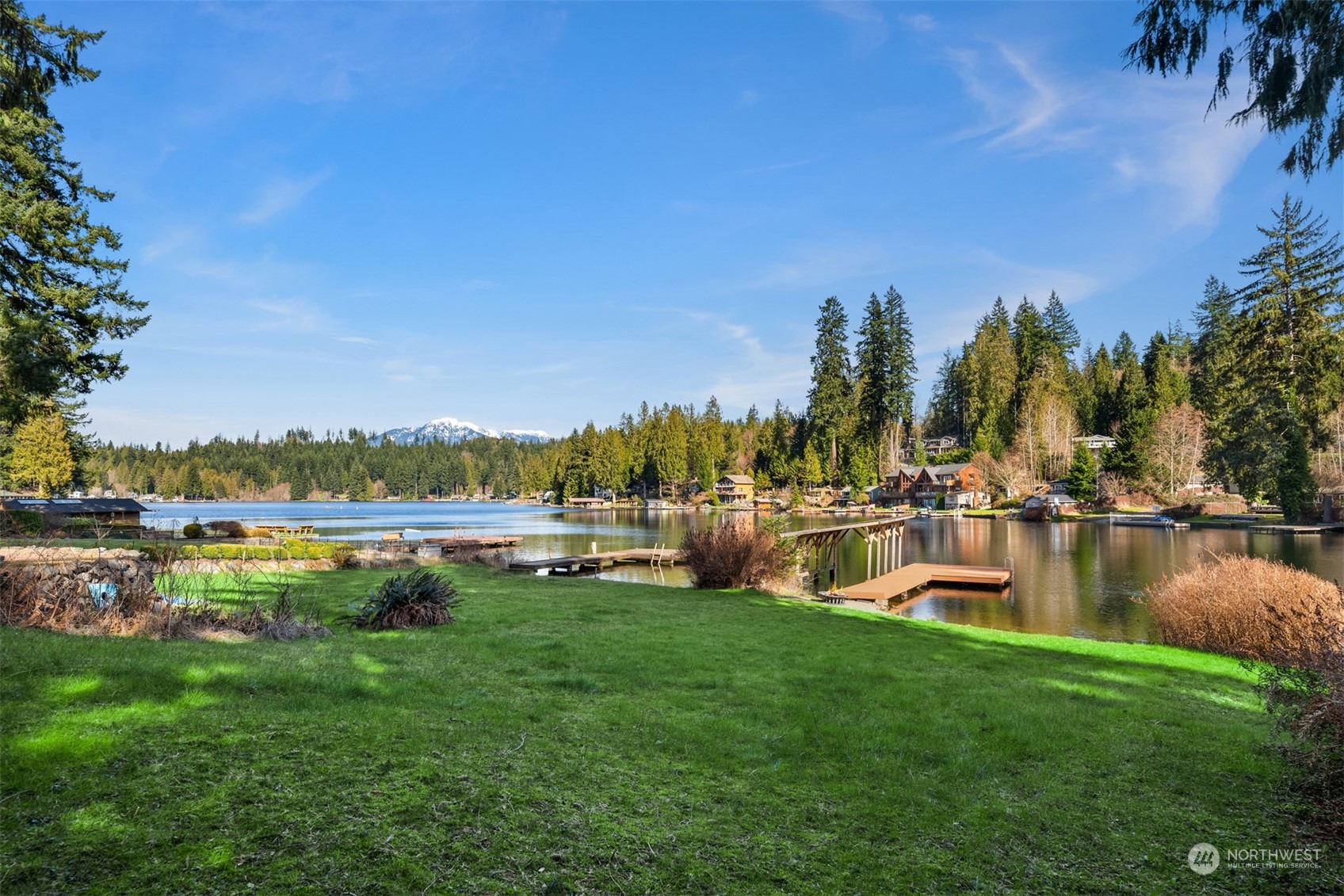 2631 Southwest Lake Roesiger Road Snohomish, WA 98290 - Photo 2 of 18 a view of a lake with houses with outdoor space