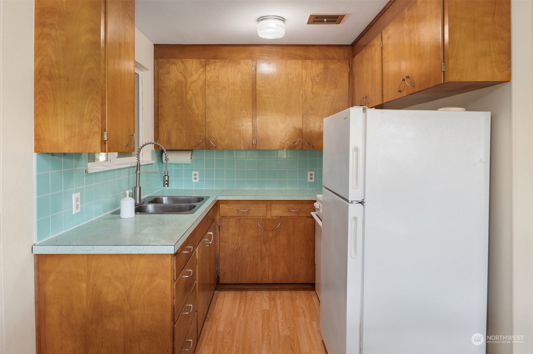 2631 Southwest Lake Roesiger Road Snohomish, WA 98290 - Photo 7 of 18 a kitchen with stainless steel appliances granite countertop a refrigerator a sink and a cabinets
