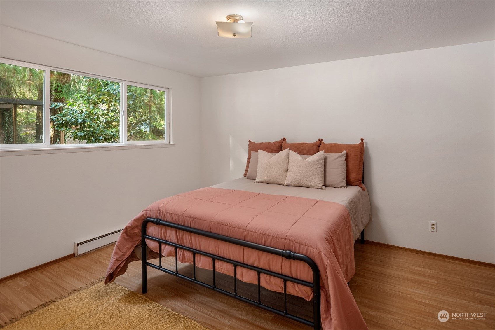 2631 Southwest Lake Roesiger Road Snohomish, WA 98290 - Photo 9 of 18 a bedroom with a bed window and a night stand