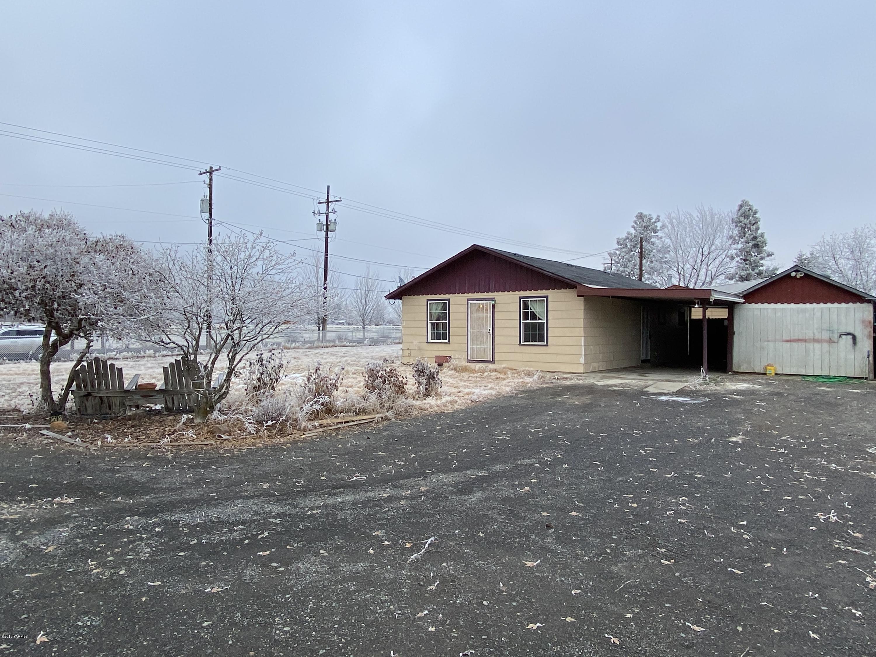 9161 South Naches Road Naches, WA 98937 - Photo 1 of 11 a front view of a house with a yard