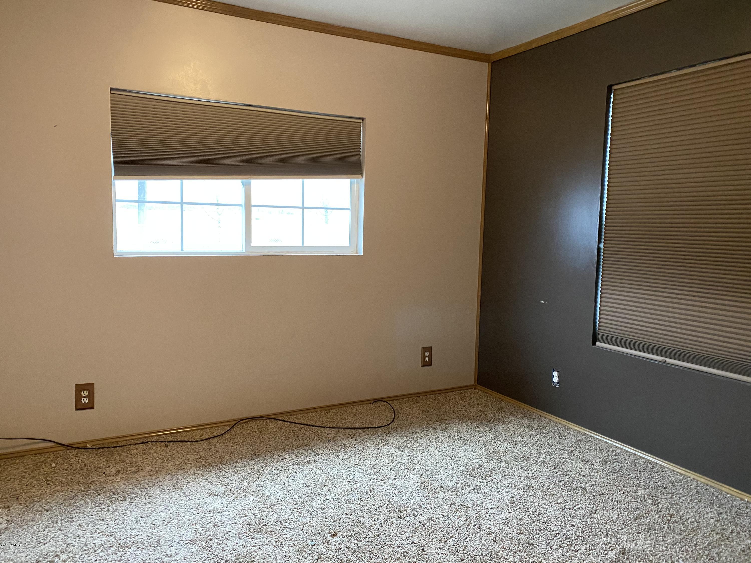 9161 South Naches Road Naches, WA 98937 - Photo 9 of 11 a view of an empty room with a window