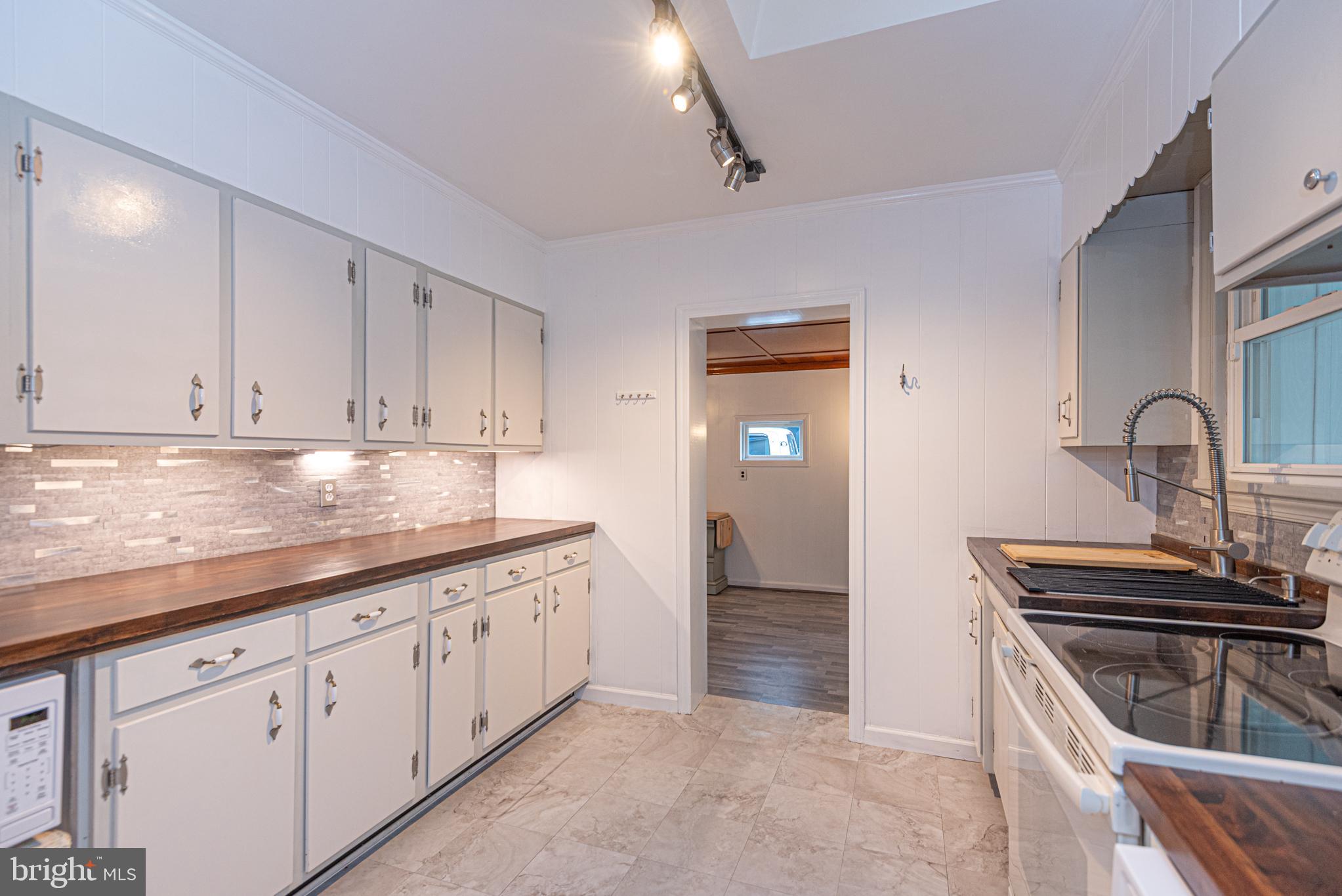 506 Park Avenue Ridgely, MD 21660 - Photo 17 of 59 a kitchen that has a sink and cabinets