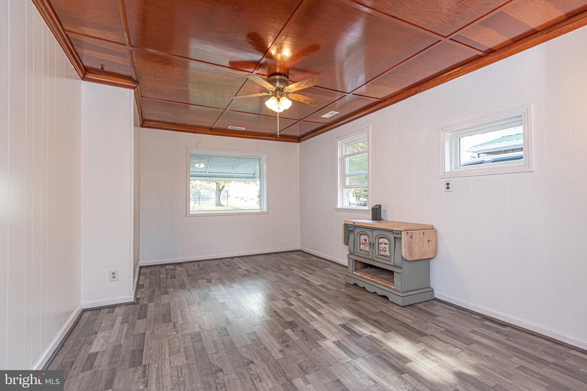 506 Park Avenue Ridgely, MD 21660 - Photo 19 of 59 an empty room with windows and ceiling fan