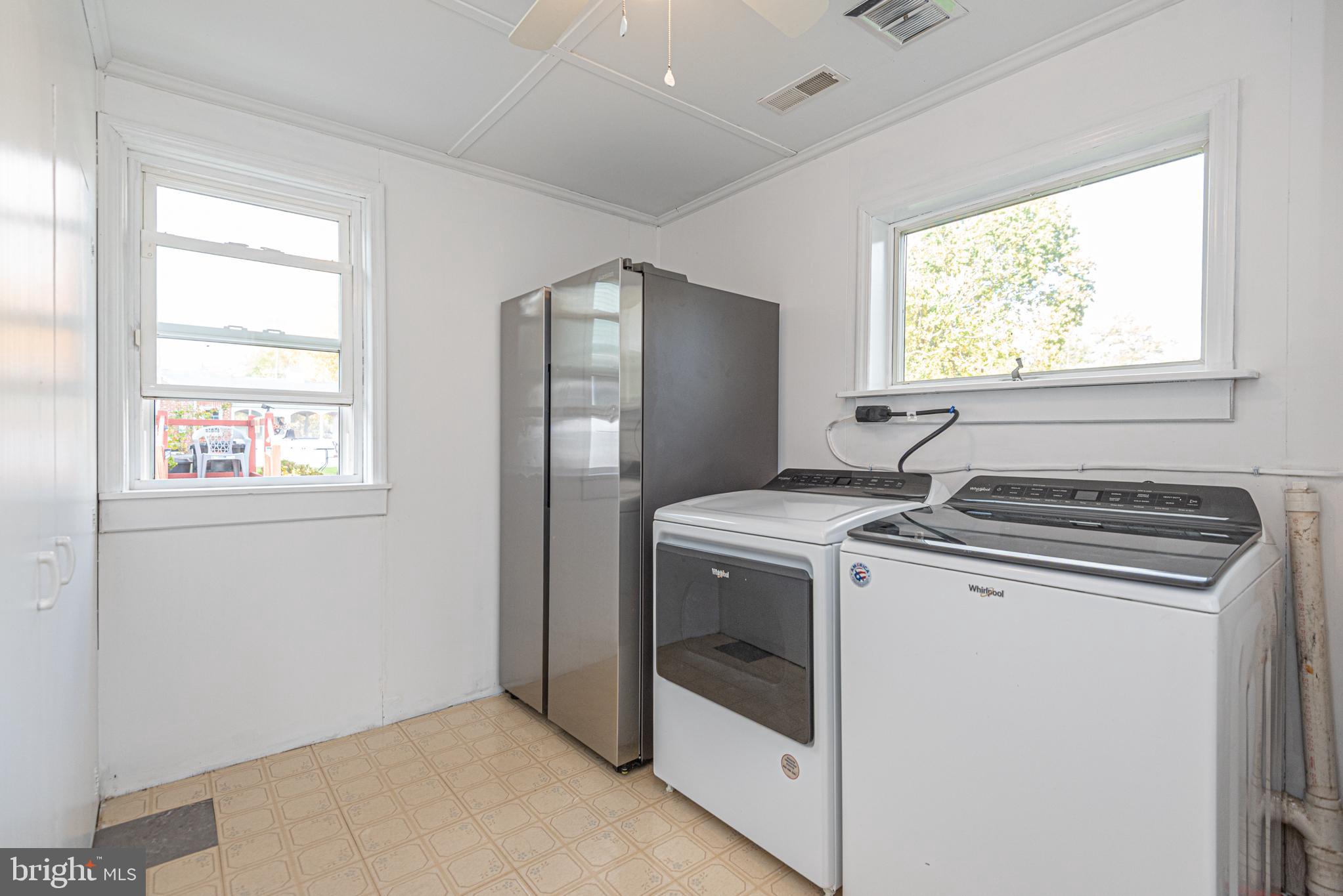 506 Park Avenue Ridgely, MD 21660 - Photo 22 of 59 a view of washer and dryer with kitchen countertops