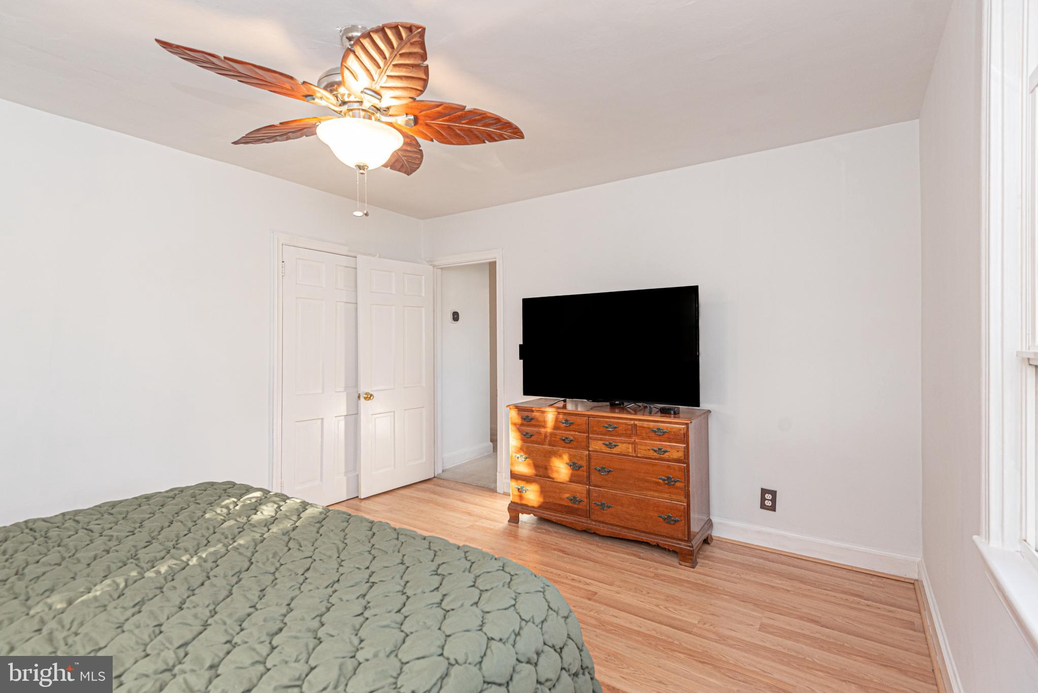 506 Park Avenue Ridgely, MD 21660 - Photo 28 of 59 a bedroom with a bed and a flat screen tv