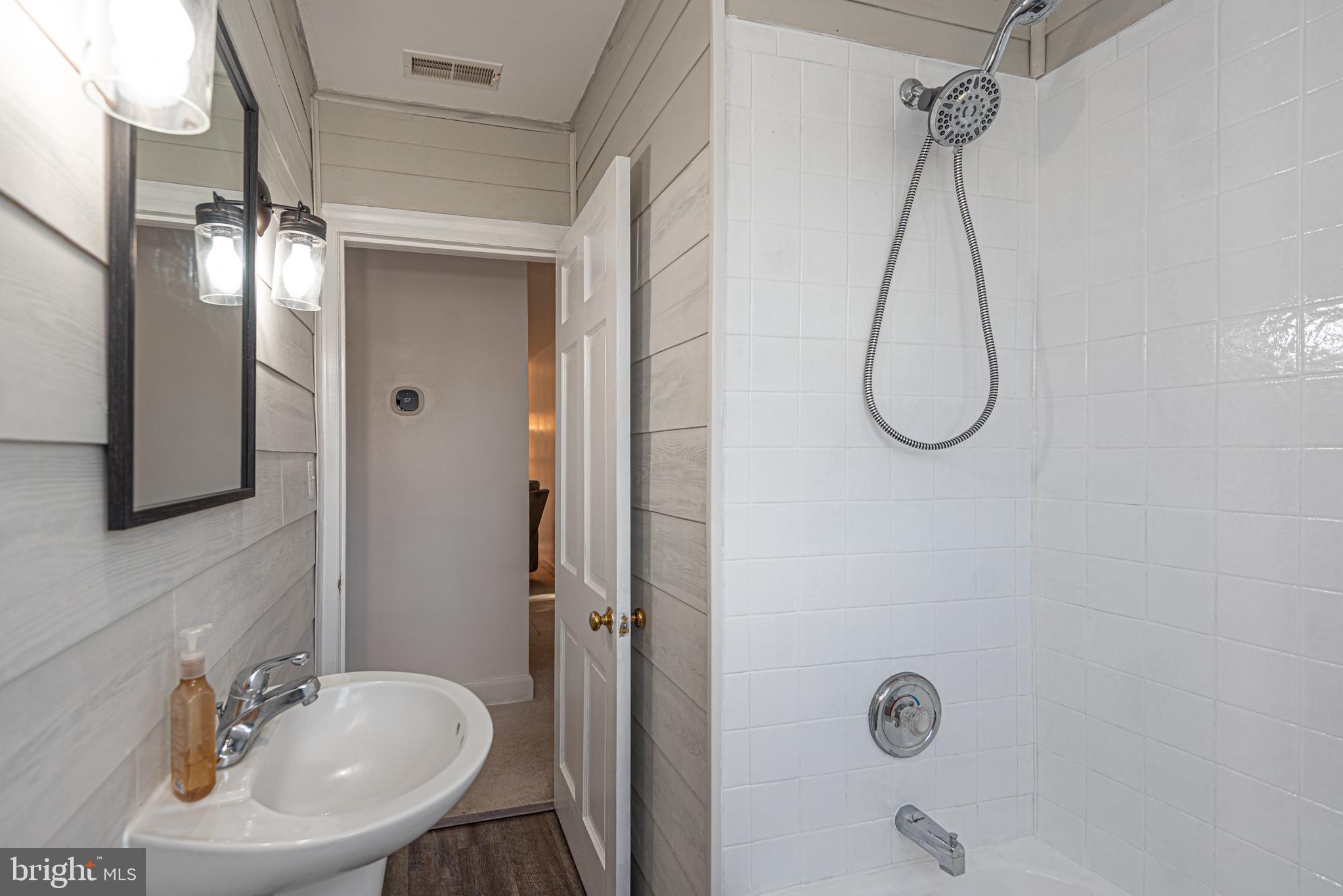 506 Park Avenue Ridgely, MD 21660 - Photo 33 of 59 a bathroom with a sink shower and mirror