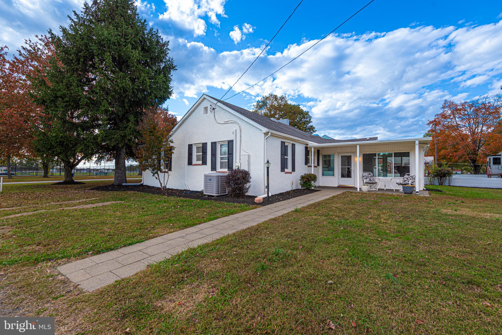 506 Park Avenue Ridgely, MD 21660 - Photo 35 of 59 a front view of a house with a garden