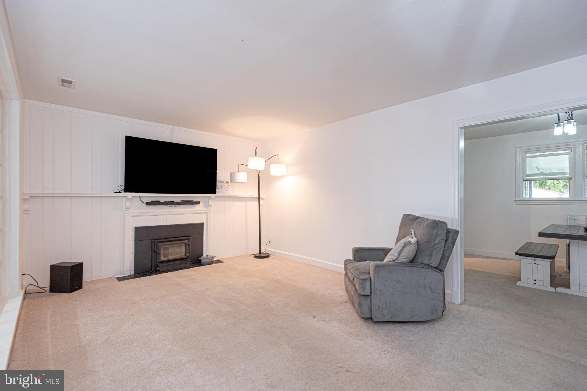 506 Park Avenue Ridgely, MD 21660 - Photo 8 of 59 a living room with furniture and a flat screen tv