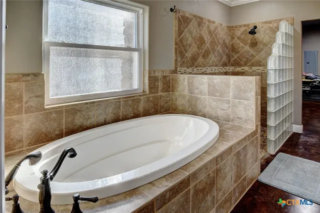 a bath tub sitting next to a window