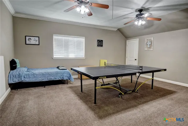 a bedroom with furniture and a chandelier
