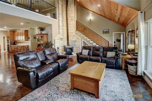 a living room with furniture and a rug