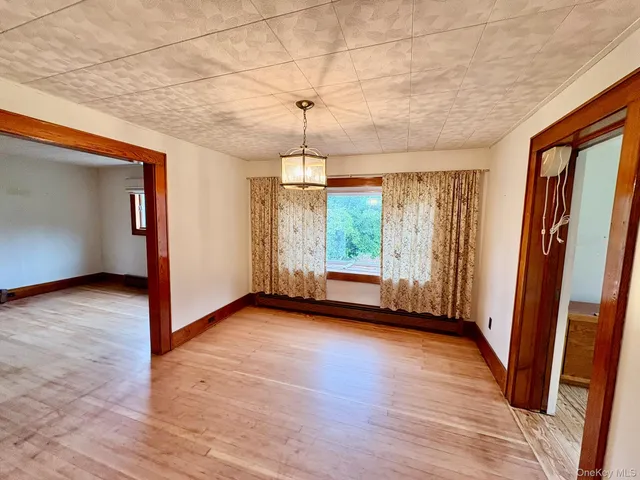 a kitchen with stainless steel appliances granite countertop a refrigerator a sink dishwasher and wooden cabinets