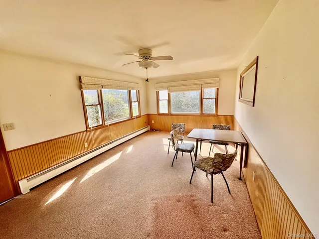 a view of a room with furniture window and wooden floor