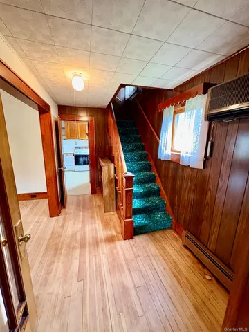 a view of an empty room and wooden floor