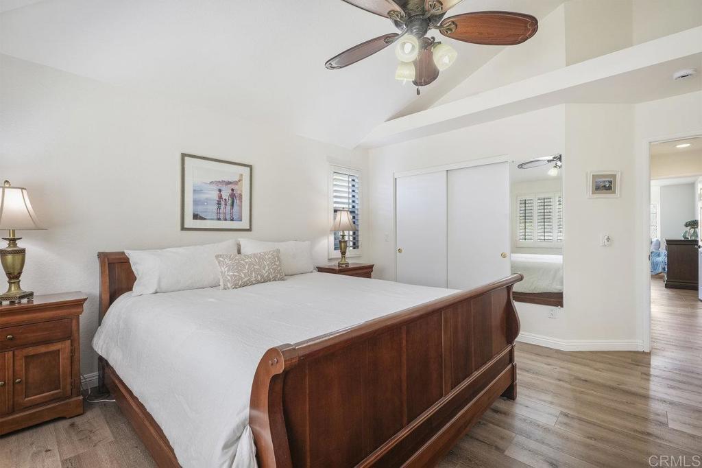 1729 Pinehurst Avenue Escondido, CA 92026 - Photo 19 of 29 a bed room with a bed and a chandelier