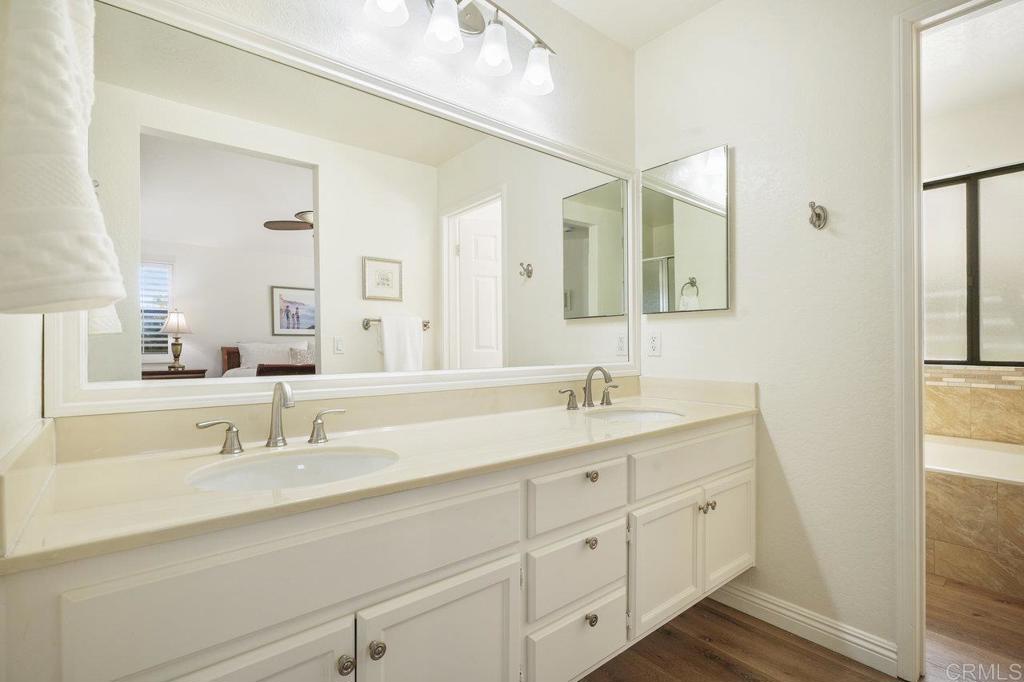 1729 Pinehurst Avenue Escondido, CA 92026 - Photo 21 of 29 a bathroom with a double vanity sink and mirror