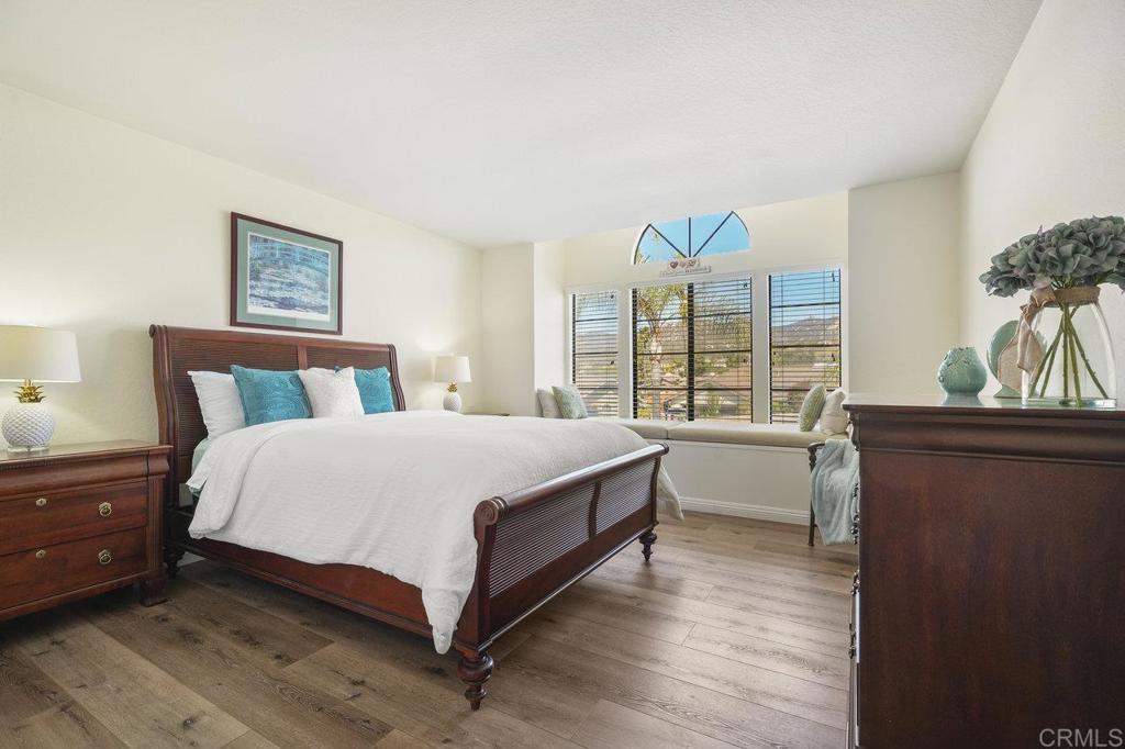 1729 Pinehurst Avenue Escondido, CA 92026 - Photo 23 of 29 a large bed sitting in a bedroom next to a window