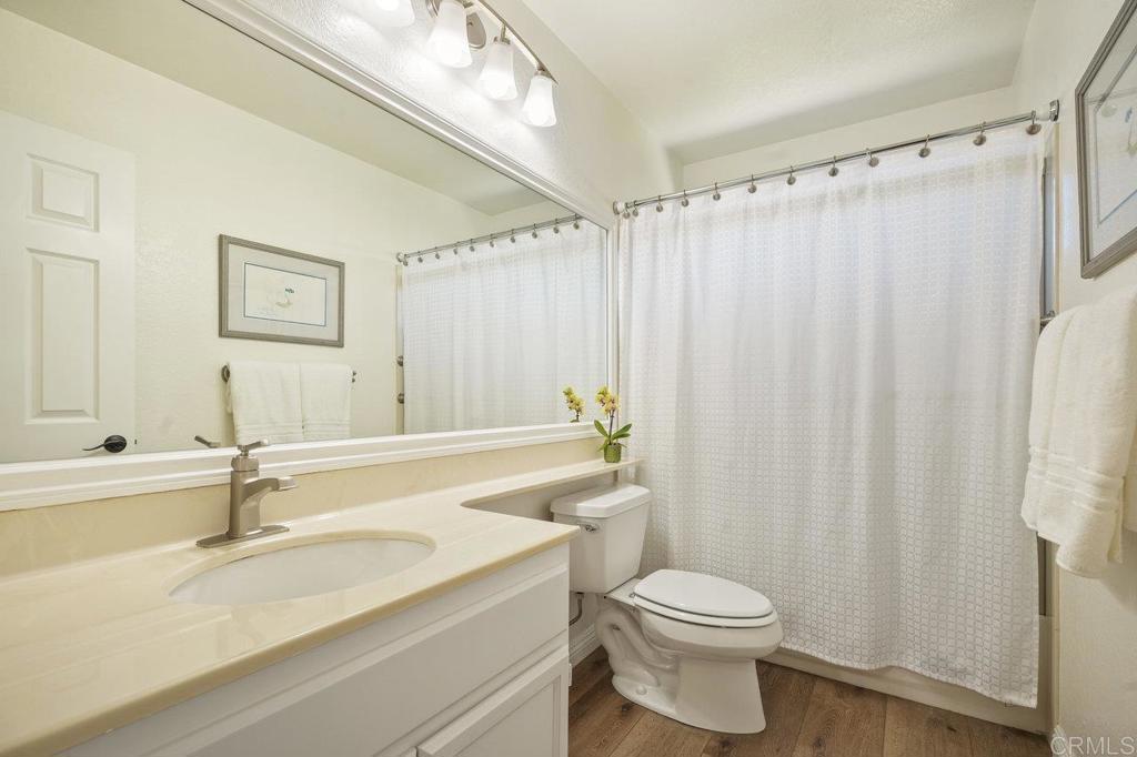 1729 Pinehurst Avenue Escondido, CA 92026 - Photo 27 of 29 a bathroom with a sink a toilet and a bathtub