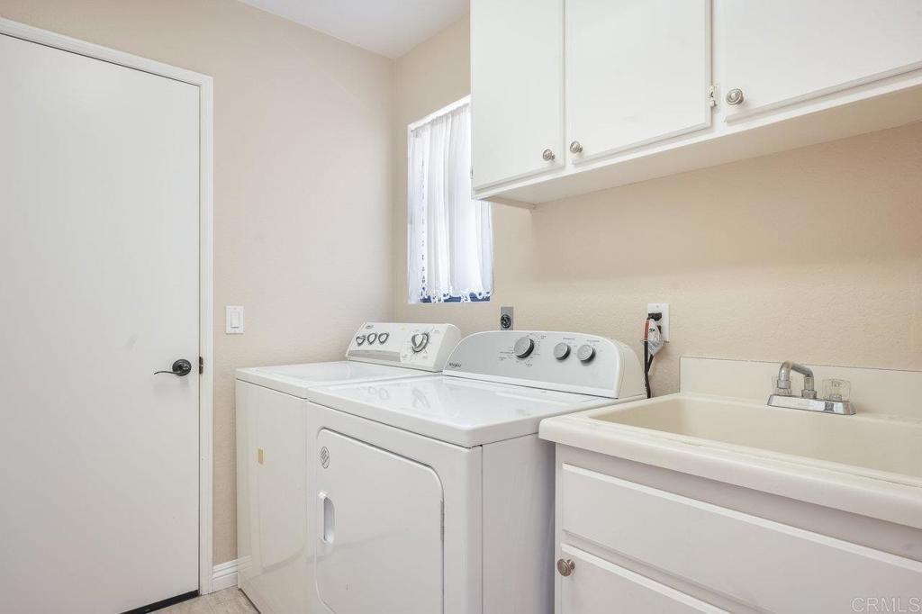 1729 Pinehurst Avenue Escondido, CA 92026 - Photo 28 of 29 a utility room with dryer and washer