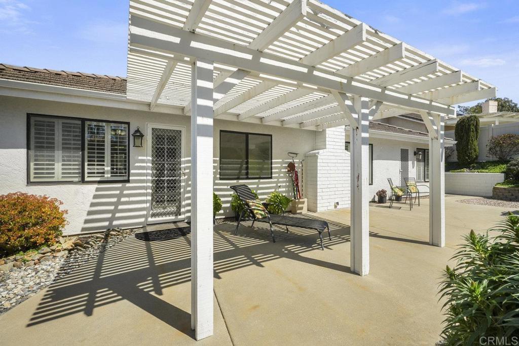 1729 Pinehurst Avenue Escondido, CA 92026 - Photo 7 of 29 a porch with a table and chairs and potted plants