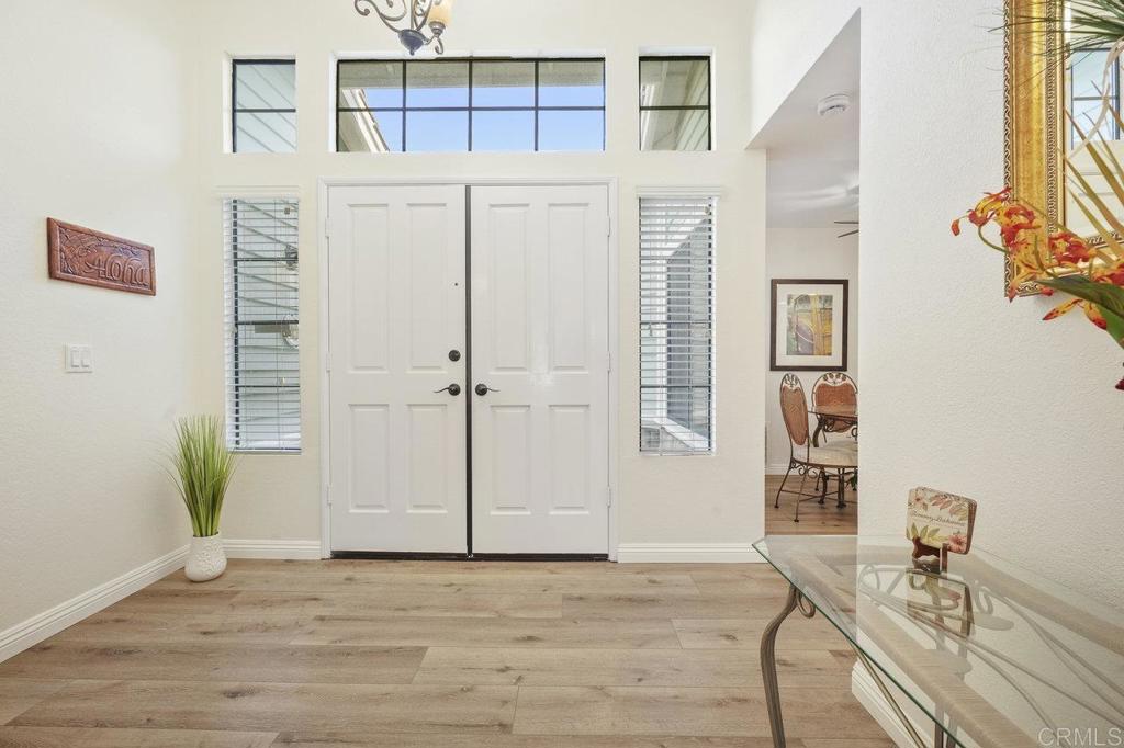 1729 Pinehurst Avenue Escondido, CA 92026 - Photo 9 of 29 a view of a room with wooden floor and windows
