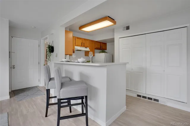 a dining room with a table and chairs