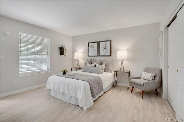 a bedroom with a bed and a couch