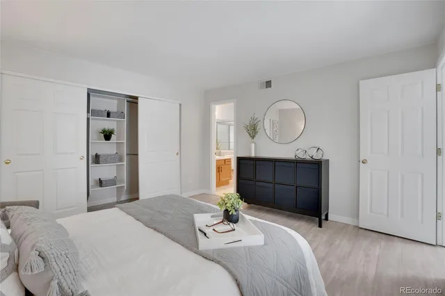 a bedroom with a bed and a dresser