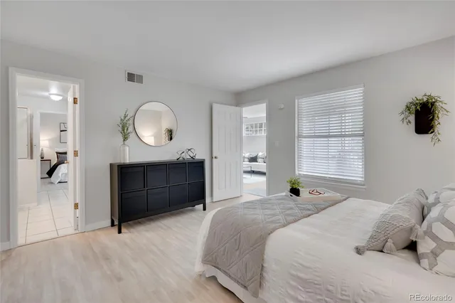 a bedroom with a bed and a dresser