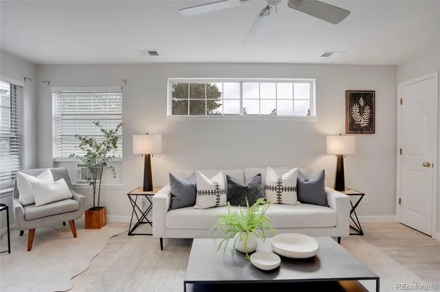 a living room with furniture and a window
