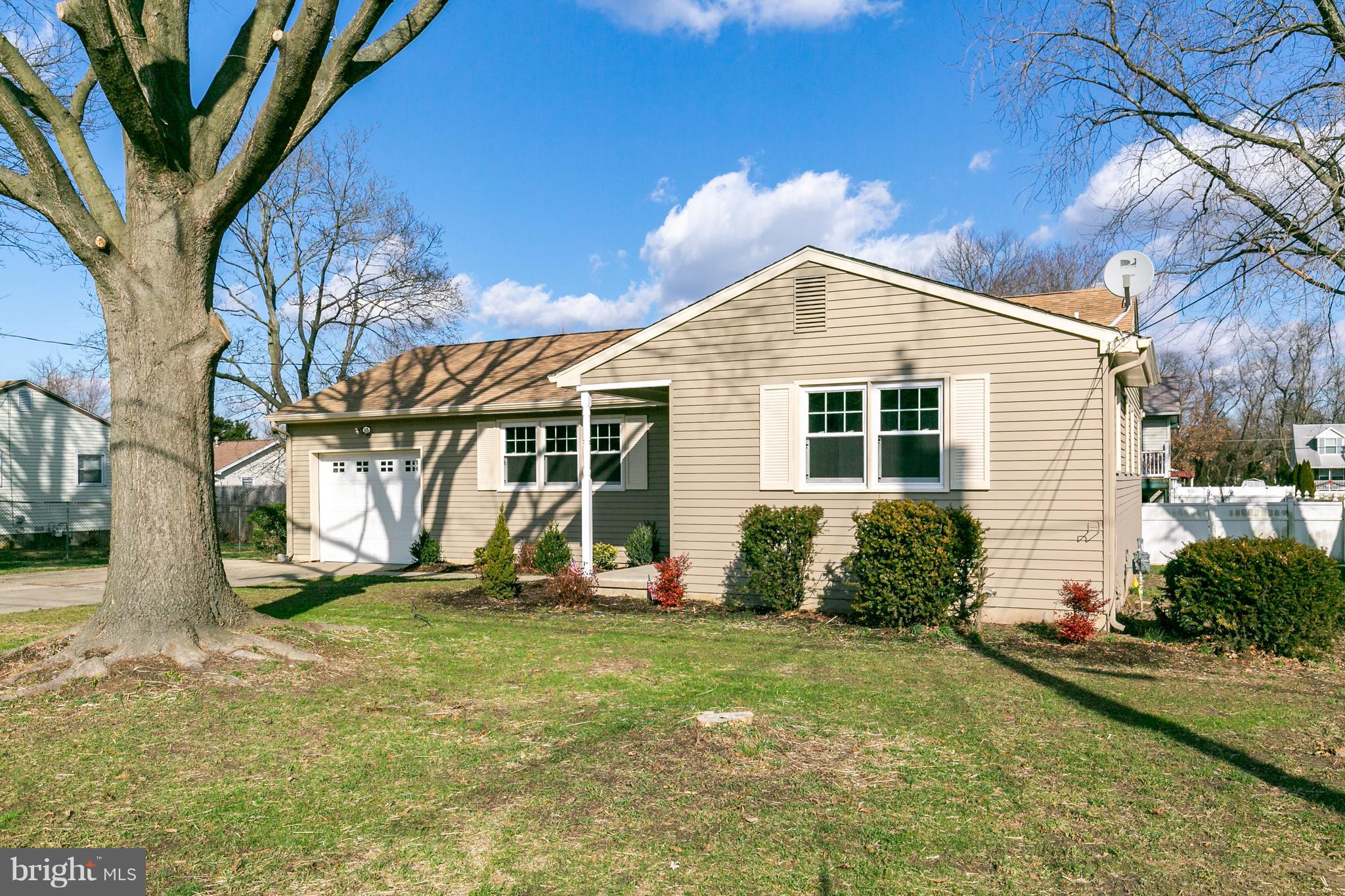 126 Eaton Road Pennsville, NJ 08070 - Photo 3 of 29 a front view of a house with garden