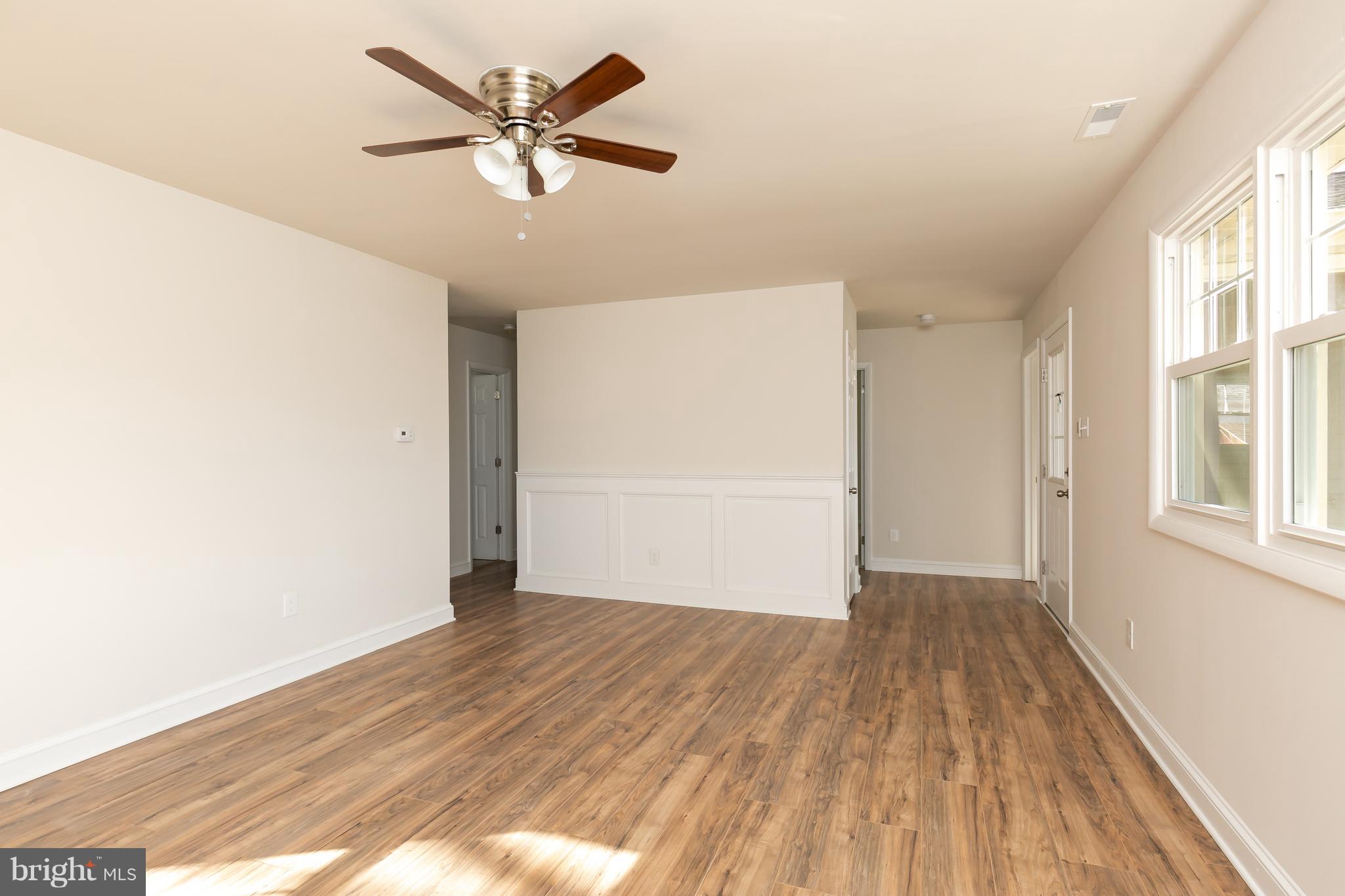 126 Eaton Road Pennsville, NJ 08070 - Photo 8 of 29 wooden floor in an empty room with a window