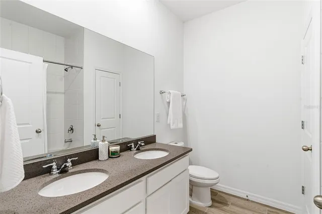 a bedroom with a baby crib and a couch