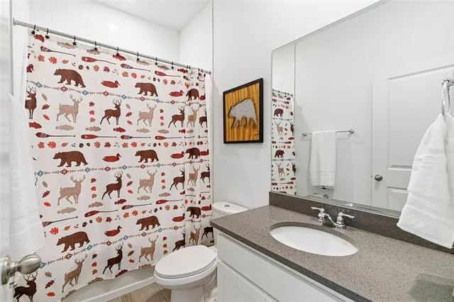 a bedroom with a bed a couch and a window