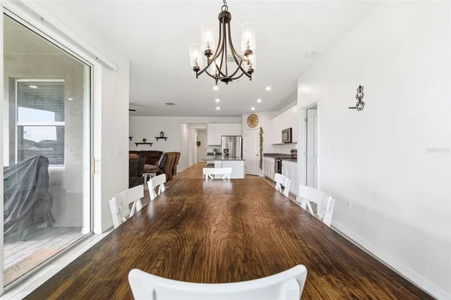 a kitchen with stainless steel appliances a sink stove microwave and cabinets