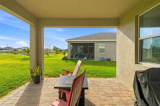 a view of a two chair under an umbrella