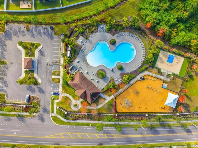 an aerial view of residential houses with outdoor space